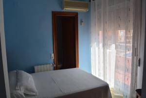 Postel nebo postele na pokoji v ubytování Hotel L'Escala