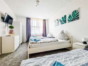 Ένα ή περισσότερα κρεβάτια σε δωμάτιο στο flat4short Dormagen