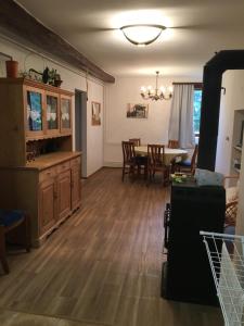 a living room with a table and a dining room at Elsa‘s Angelparadies in Dunafalva