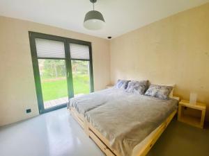 A bed or beds in a room at Pieniny LOVE