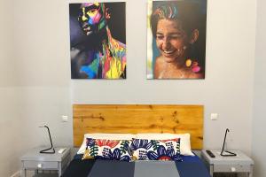 
a bed with a picture of a woman on it at Arc House Madrid - Puerta del Sol Only Adults in Madrid
