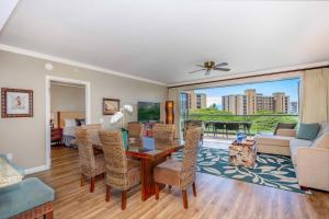 a living room with a table and chairs at Maui Westside - Honua kai Konea 642/643 in Kaanapali
