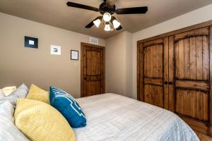 a bedroom with a bed with a ceiling fan at 1700 South 2nd in Waco