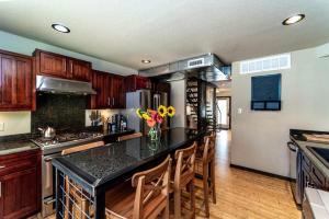 a kitchen with wooden cabinets and a black counter top at 1700 South 2nd in Waco