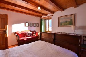 Ένα ή περισσότερα κρεβάτια σε δωμάτιο στο Bed and Breakfast da Käthy Agriturismo