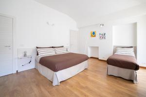 Postel nebo postele na pokoji v ubytování TO.STA BwithoutB HOME SHARING NEL CENTRO DI TORINO