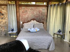 Cama o camas de una habitación en Pousada Rocamadour