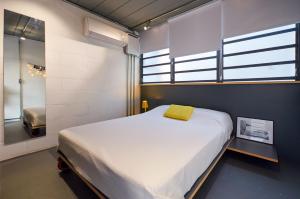 Tempat tidur dalam kamar di Vila Pitanga Hosting