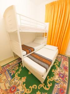 Ένα ή περισσότερα κρεβάτια σε δωμάτιο στο Homestay Kondo Mewah l/d kolam renang & playground di Kota Bharu
