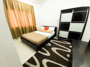 Ένα ή περισσότερα κρεβάτια σε δωμάτιο στο Homestay Kondo Mewah l/d kolam renang & playground di Kota Bharu +30 φωτογραφίες