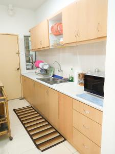 Η κουζίνα ή μικρή κουζίνα στο Homestay Kondo Mewah l/d kolam renang & playground di Kota Bharu