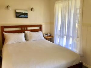 מיטה או מיטות בחדר ב-Promhills Cabins