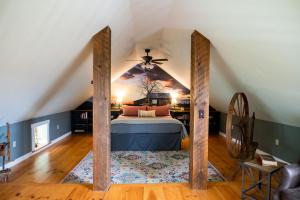 a bedroom with a bed in a attic at Craftsbury Farmhouse in Craftsbury