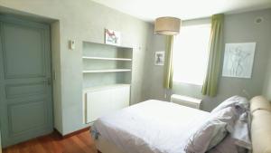 a bedroom with a bed and a book shelf at Luxe et charme Vieil Antibes 80m2 Clim Parking plages à pieds in Antibes