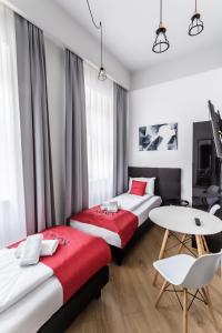 Posteľ alebo postele v izbe v ubytovaní Apartamenty Nowa Kamienica Częstochowa Centrum Szymanowskiego 22A