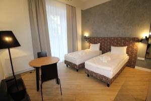 Posteľ alebo postele v izbe v ubytovaní Apartamenty Nowa Kamienica Częstochowa Centrum Szymanowskiego 22A