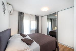 Łóżko lub łóżka w pokoju w obiekcie Apartment Marul