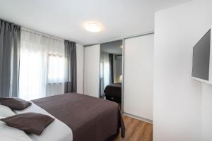 Łóżko lub łóżka w pokoju w obiekcie Apartment Marul