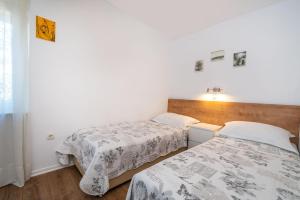 Łóżko lub łóżka w pokoju w obiekcie Apartment Marul
