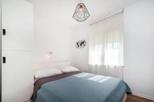 Posteľ alebo postele v izbe v ubytovaní Apartment Marul