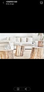 a picture of a living room with two wooden tables at Opaline Baie de somme in Ault