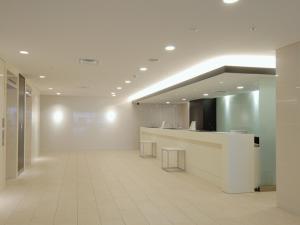 an empty lobby with a counter in a building at Meitetsu Inn Nagoya Nishiki in Nagoya