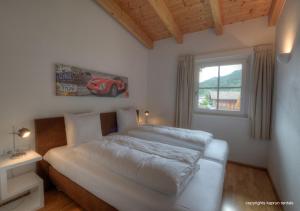 Voodi või voodid majutusasutuse Ski & Golf Apartments by Kaprun Rentals toas