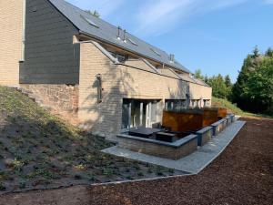 a building with a large window on the side of it at Terrasse de Malmedy Malmedy nature 338 in Malmedy