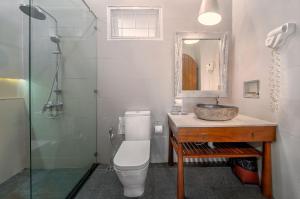 a bathroom with a toilet and a sink and a shower at Samed Villa Resort in Ko Samed +37 photos