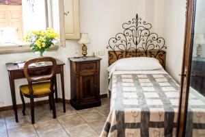 Postel nebo postele na pokoji v ubytování Hotel Il Bargellino