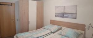 Postel nebo postele na pokoji v ubytování Ferienwohnung Collato - Boppard Zentrum am Marktplatz