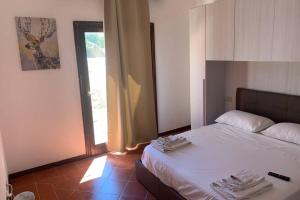 Кровать или кровати в номере A.E. Stintino Relax House