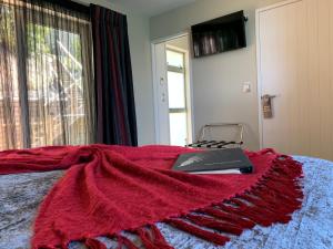 מיטה או מיטות בחדר ב-Kaiteriteri Retreat