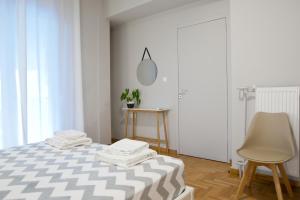 Posteľ alebo postele v izbe v ubytovaní Acropolis View Penthouse N