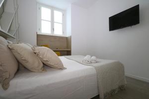 Postel nebo postele na pokoji v ubytování Affittacamere I Due Leoni