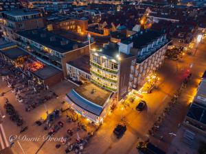 an overhead view of a city at night at Hotel Noordzee in Katwijk