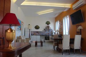 Telewizja i/lub zestaw kina domowego w obiekcie La Maison del Sole