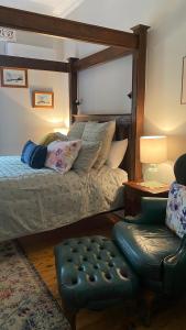 
a woman laying on a bed in a bedroom at Palmyra B&B in Rainbow Flat
