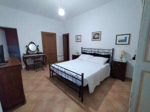 Postel nebo postele na pokoji v ubytování B&B L'Oliveto