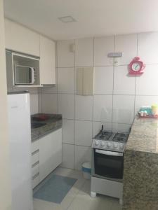 Dapur atau dapur kecil di Lindo Ap 403 Quadra do Mar c Garagem
