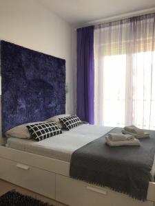 a bedroom with a large bed with a window at Apartment in Salerno Parco in Salerno