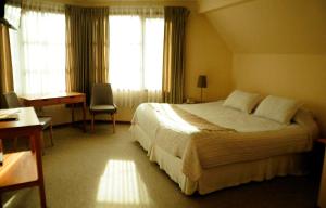 Postel nebo postele na pokoji v ubytování Hotel Seminario