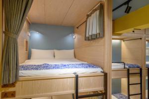 Letto o letti in una camera di 山多香青年民宿 Santhosham Hostel