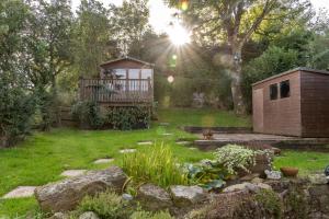 a backyard with a gazebo and a garden at Finest Retreats - Brecon View Cottage in Clydach