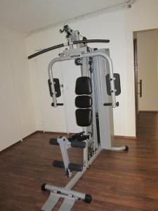 a gym with a squat rack and weights at Finn Rooms in Tampere