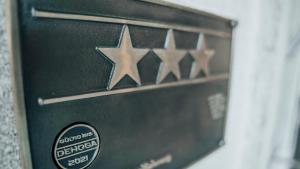 a close up of a metal box with four stars at Avantgarde Hotel in Hattingen