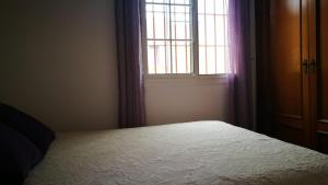 A bed or beds in a room at Urb Tortuga 1 Adults Recommended