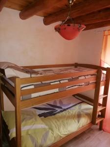 a bunk bed in a room with a ceiling at Gite a la ferme in Le Malzieu-Ville