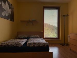 Postel nebo postele na pokoji v ubytování Apartmán Švadlenka