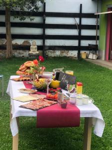 a table with a buffet of food on it at La casa de Jesús Llandres in Husillos